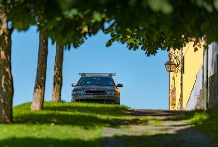 Old car parked near house in street of Alesund, Norway, Scandinavia, Europeの写真素材