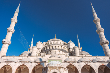 Old and beautiful Sultan Ahmed Mosque (Blue Mosque) Ottoman imperial mosque located in Istanbul, Turkey. Blue sky in background.の写真素材