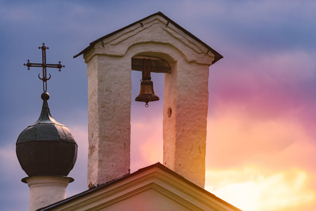 Church dome and bell tower in Russia at sunsetの写真素材