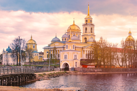 Monastery on island of lake Seliger, Russia. Stolobny Island is an island on Lake Seliger in the Tver Oblast. Sunset time.の写真素材
