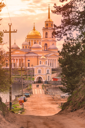Monastery on island of lake Seliger, Russia. Stolobny Island is an island on Lake Seliger in the Tver Oblast. Sunset time.の写真素材