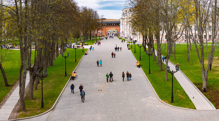 NOVGOROD, RUSSIA - MAY 2, 2014: People walking at Novgorod Kremlin with wall and arch in background.のeditorial素材