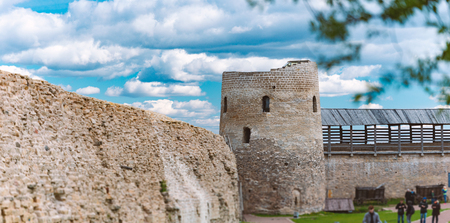 Old medieval castle of Izborsk in Russia. Tower and castle wall with blue cluody sky in background.のeditorial素材