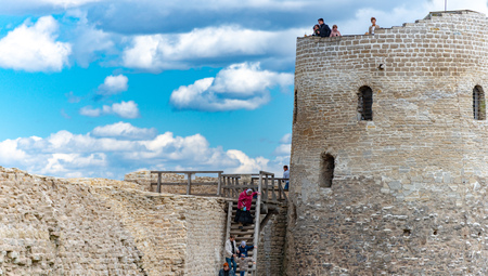 IZBORSK, RUSSIA - MAY 3, 2014: Old medieval castle of Izborsk in Russia. Tower and castle wall with blue cluody sky in background.のeditorial素材