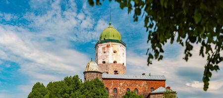 Architecture of old town Vyborg, Russia, Europe. Saint Olaf tower and Vyborg castle on summer day.の写真素材