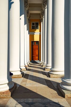 Old building in Saint Petersburg, Russia. Rows of columns with light and shadowsの写真素材