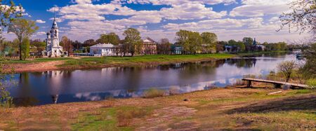 Old church in Vologda, Russia, Europe. Blue sunset sky in background and river in foreground. Travel and religion.の写真素材