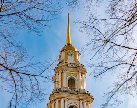 Rybinsk bell tower in Russia. Blue sky in background and tree branches.の写真素材