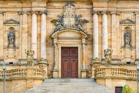 Grand doors of cathedral in Germany. Entrance in high arch with a lot of sculpture in it and statues on walls. Architecture of Europe.の写真素材