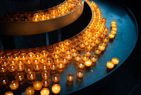 Candles in church of Wurzburg, Bavaria, Germany. Religion and christianity attributesの写真素材