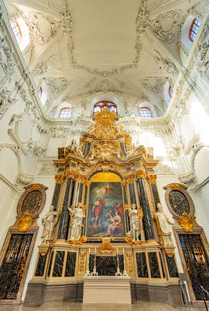 Old golden church altar in Wurzburg, Bavaria, Germany. Statues and white interior.のeditorial素材