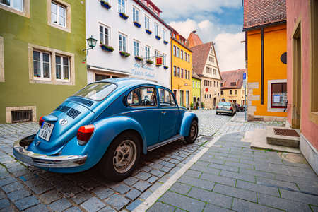 Rothenburg Ob Der Tauber, Germany - SEPTEMBER 24, 2014: View on city street with old german car. Bavaria, Germany, Europeのeditorial素材