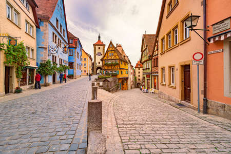 Rothenburg Ob Der Tauber, Germany - SEPTEMBER 24, 2014: View on old city street with traditional architecture of Rothenburg Ob Der Tauber, Bavaria, Germany, Europeのeditorial素材