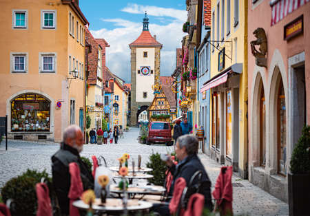 Rothenburg Ob Der Tauber, Germany - SEPTEMBER 24, 2014: View on old city street with traditional architecture of Rothenburg Ob Der Tauber, Bavaria, Germany, Europeのeditorial素材