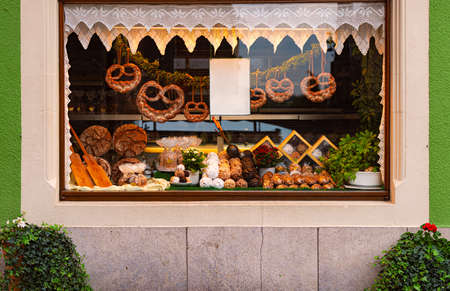 Shop window with traditional bakery in old city street with traditional architecture of Rothenburg Ob Der Tauber, Bavaria, Germany, Europeのeditorial素材