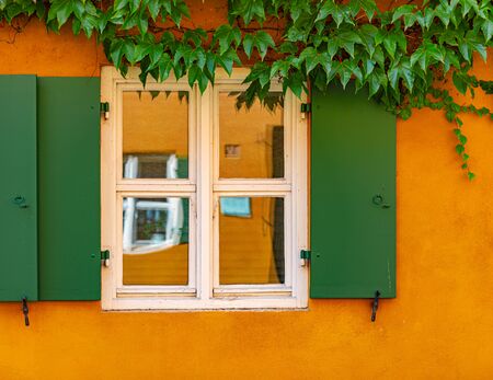 The Fuggerei is the world's oldest social housing complex still in use. It is a walled enclave within the city of Augsburg, Bavaria, Germanyの写真素材