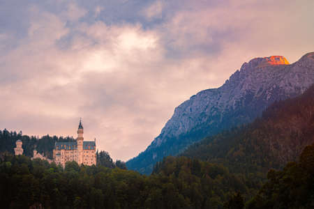 Mountains and lake in Bavaria, Germany, Europe. Sunrise scene with meadow in foreground and cloudy sky in backgroundのeditorial素材