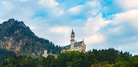 Mountains and lake in Bavaria, Germany, Europe. Sunrise scene with meadow in foreground and cloudy sky in backgroundのeditorial素材
