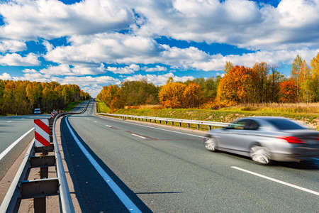 Fast moving car on a highway in Bavaria, Germany, Europe. Auto travel.の写真素材