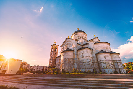 Cathedral of the Resurrection of Christ, Podgorica, Montenegro, Europe. Blue sky with clouds in background. Sun and sunset scene.のeditorial素材