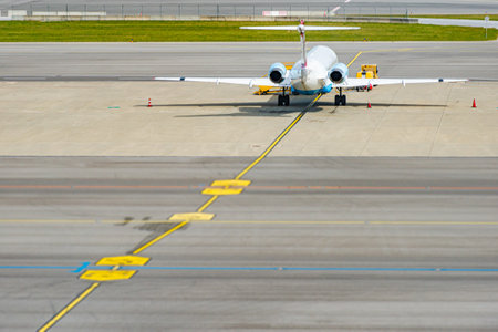Modern passanger jet parked at runway in airport. Air travel and airplanes.のeditorial素材