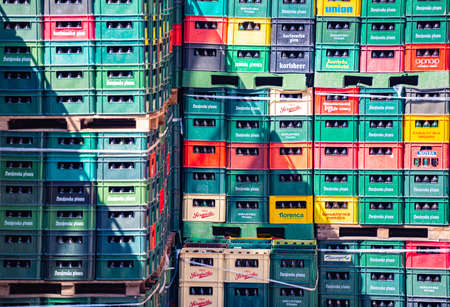 Containers with bottles of beer in warehouse. Rows of plastic crates.のeditorial素材