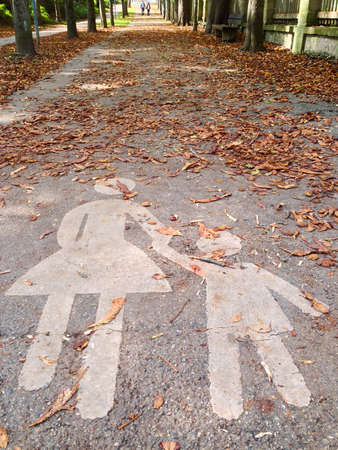 Pedestrian sign on a sidewalk in German town, Europe.の写真素材