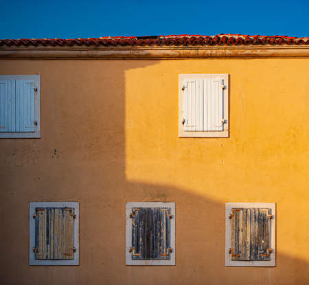 Window of old building in Montenegro, Europe. City architecture and details. Blue sky in background.の写真素材