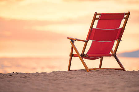 Chair at sunset on beach in Santa Monica, California, USAの写真素材