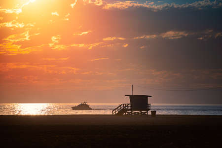 Lifeguard crew watching ocean at sunset in Santa Monica, California, United States of Americaの写真素材