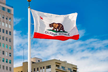 Flag of California Republic in San Francisco. Blue sky with clouds in background.の写真素材