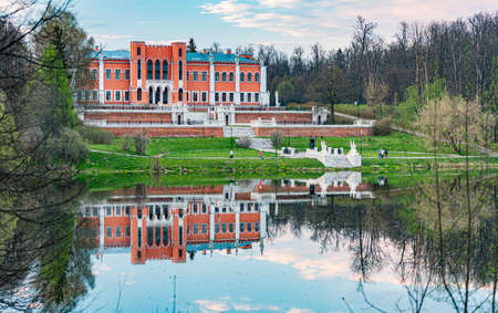Beautiful old buidling in Russian with lake in foreground and sky with clouds in backgroundのeditorial素材