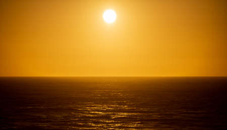 Sunset over pacific ocean at Big sur coast in California, United States of America.の写真素材