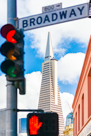 Bbroadway street sign in San Francisco, California, USA. Transamerica pyramid building in background.のeditorial素材