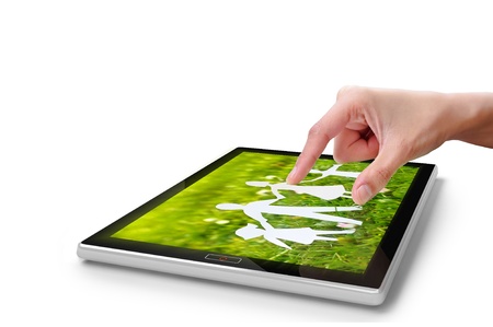 Hand touching screen on digital tablet pc  Close-up finger の写真素材