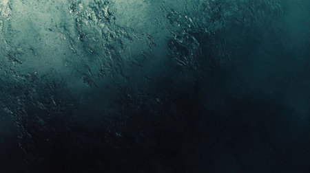 A sleek blue-to-black gradient background with grainy texture effects, ideal for a futuristic web banner.の素材