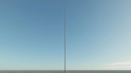 A pole vault setup standing tall against a clear blue sky.の素材