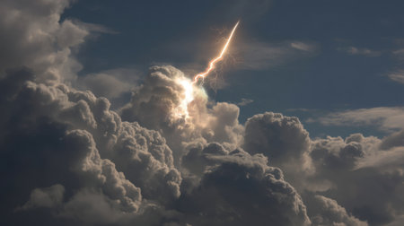 A breathtaking view of lightning striking through thick storm clouds, showcasing the raw power of nature. This dramatic scene captures the essence of a turbulent sky.の素材
