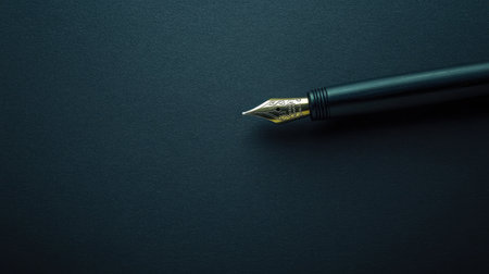 Stylish vintage black pen on black paper. Minimalistic and elegant image perfect for creative and writing concepts.の素材