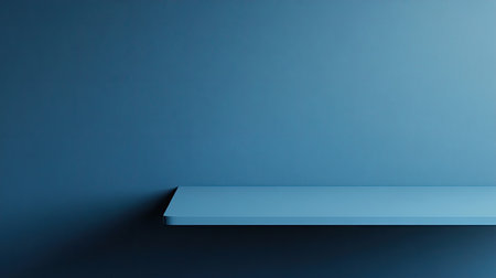 Simple blue tabletop with a matching blue wall background, offering a clean product stage for modern designs.の素材