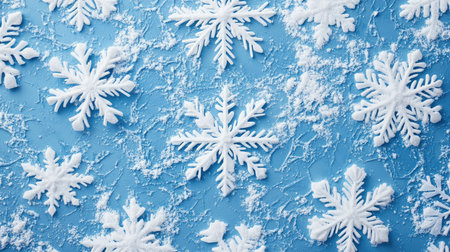 Snowflakes on a blue background, perfect for Christmas and winter-themed designs and decorations.の素材