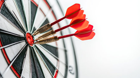 Dartboard on a white background with darts showing a mix of successes and failures, representing the challenge of precision in competition.の素材