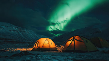 Travelers' tents illuminated by the northern lights, with vivid colors dancing across the sky, creating a surreal and awe-inspiring camping experience.の素材