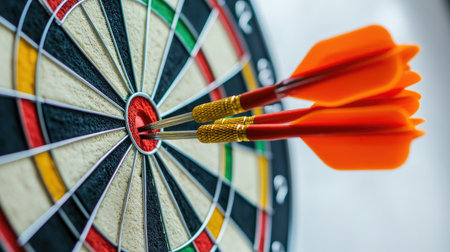 Dartboard on a white background with darts showing a mix of successes and failures, representing the challenge of precision in competition.の素材