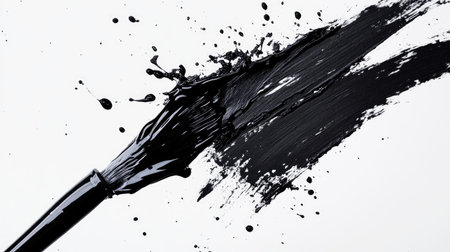 A brush creates a powerful black paint splash on a clean white background, emphasizing the stark contrast and dynamicの素材