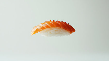 A delicate sushi nigiri hovers in mid-air against a pristine white background, highlighting the artistry and simplicity of Japanese culinary traditions.の素材