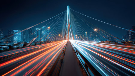 A breathtaking urban scene showcasing a modern bridge at night, illuminated by vibrant light trails from passing vehicles, surrounded by a stunning city skyline.の素材