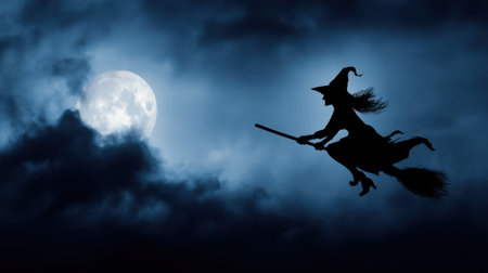 A silhouette of a witch flying on a broomstick against a full moon, surrounded by dark clouds, adding a touch of mystery and enchantment to the night scene.の素材