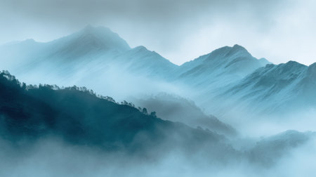 Explore the enchanting beauty of a mist-covered mountain range that evokes a sense of calm and tranquility in the great outdoors, ideal for nature lovers and adventurers.の素材