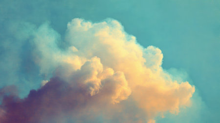 A stunning view of fluffy clouds against a bright blue sky, evoking feelings of peace and beauty, ideal for nature-themed projects and creative designs.の素材